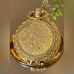 Vintage Max Factor Gold-Tone Ornate Locket Necklace. Contains Glittery Perfume.